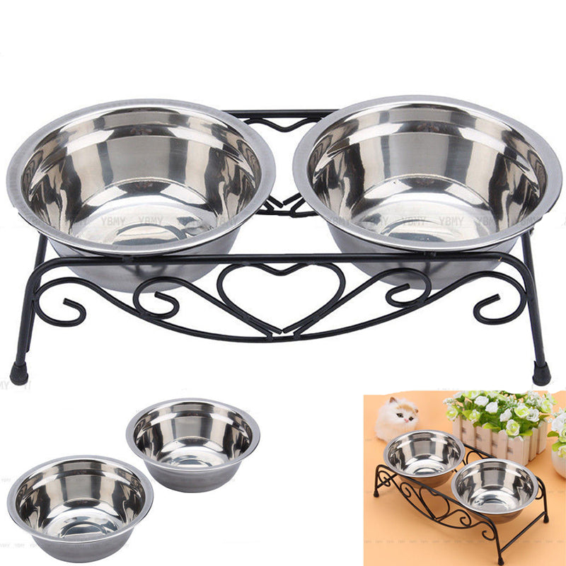 Stainless steel pet bowls on a decorative metal stand with heart design.