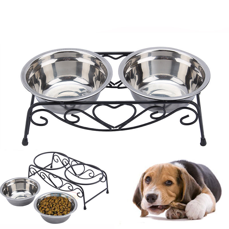 Pet feeding station with two stainless steel bowls on a decorative stand, accompanied by a dog.