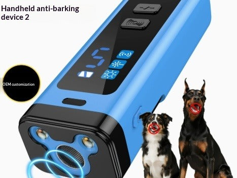 Blue and black handheld pet barking device shown on a white background with two dogs beside it. Text on the image reads 'Handheld anti-barking device 2' and includes a circular badge saying 'OEM customization'.