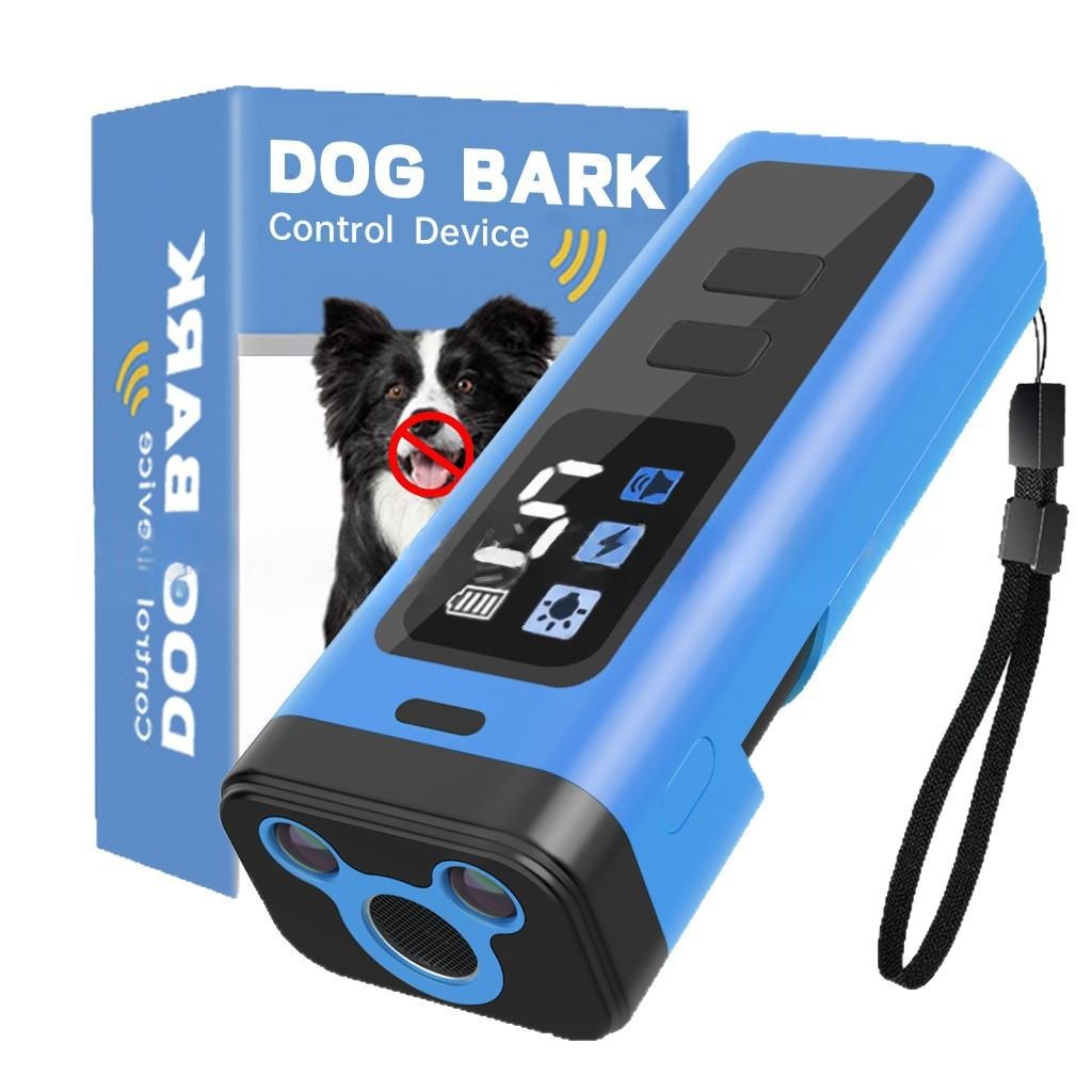 Blue and black dog bark control device shown with its retail box on a white background. The device has a wrist strap and a front speaker grille, with a digital display panel on the side.
