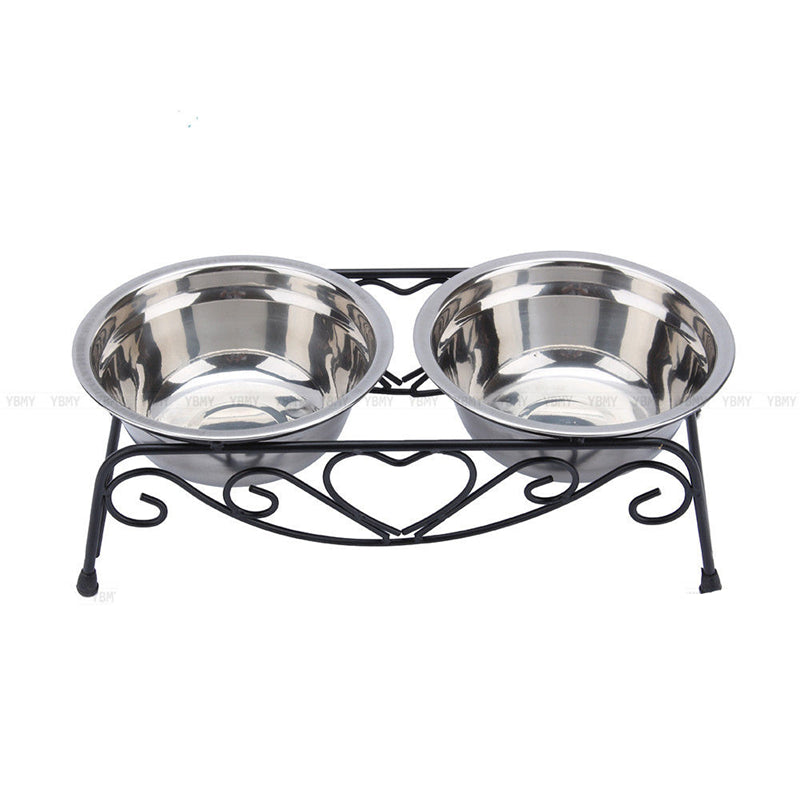 Double stainless steel pet bowl set on a decorative black metal stand with heart design.