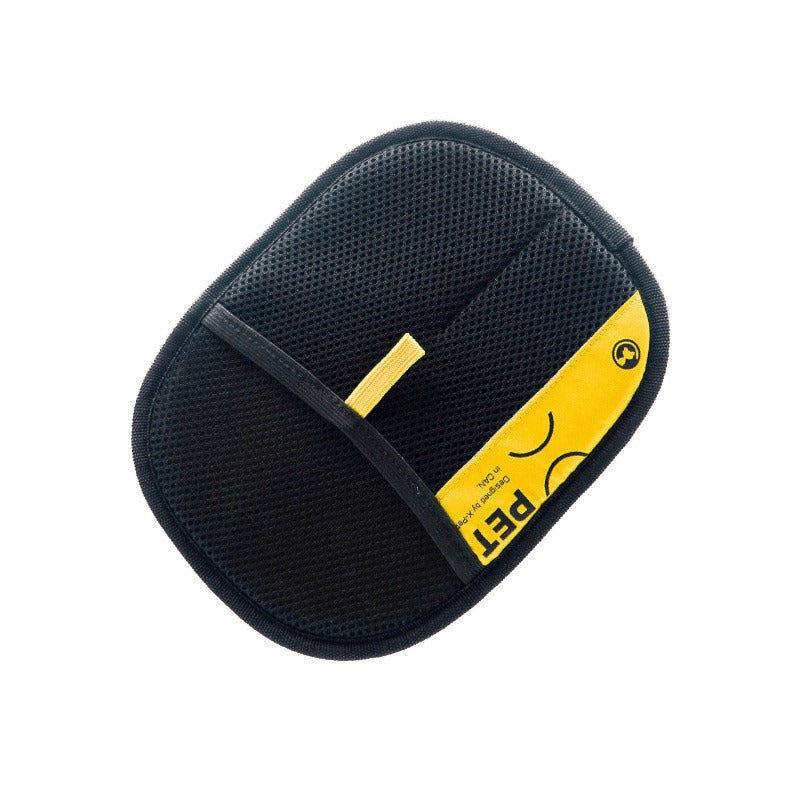 Black pet carrier with yellow label on a white background